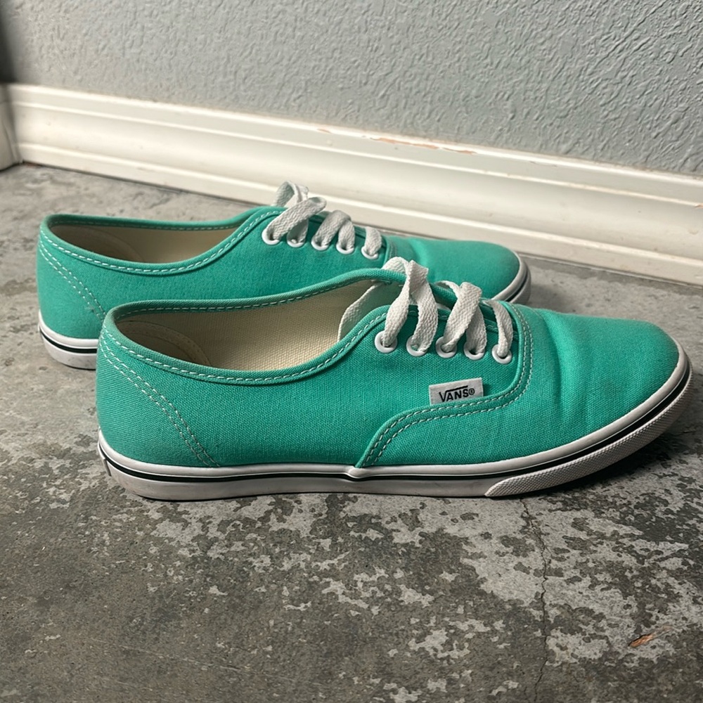 Vans teal colored lo pro shoes.